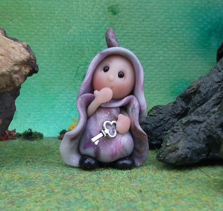 January Offer Tiny Doubtful Gnome 'Della' with hand on mouth by Ann Galvin
