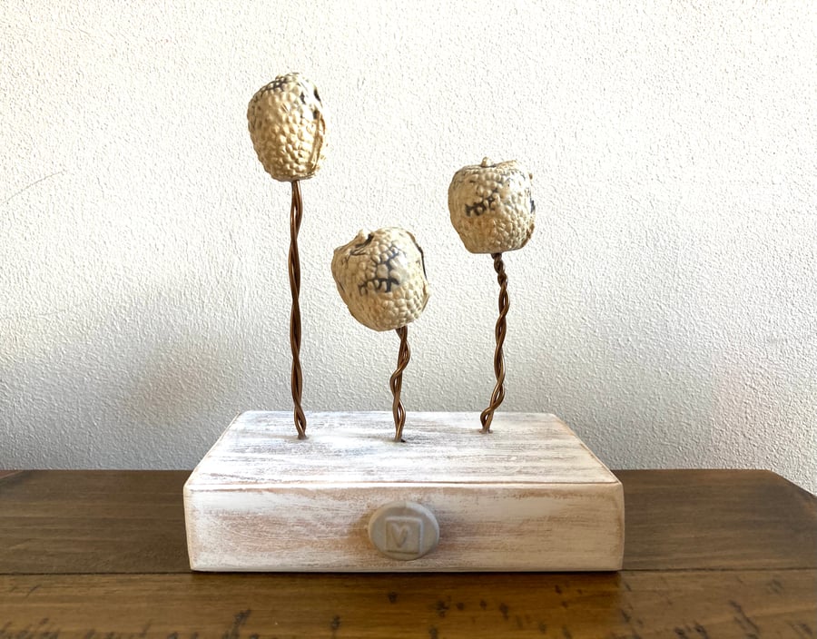 Ceramic sculptures on wire, wood base, home decor