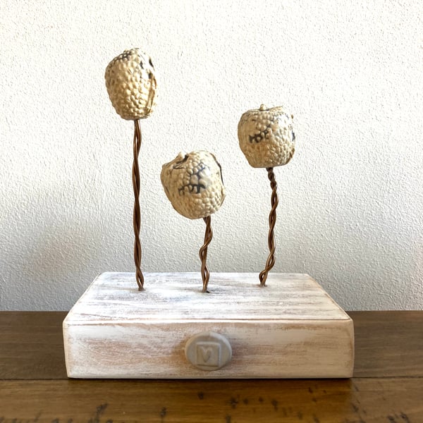 Ceramic sculptures on wire, wood base, home decor