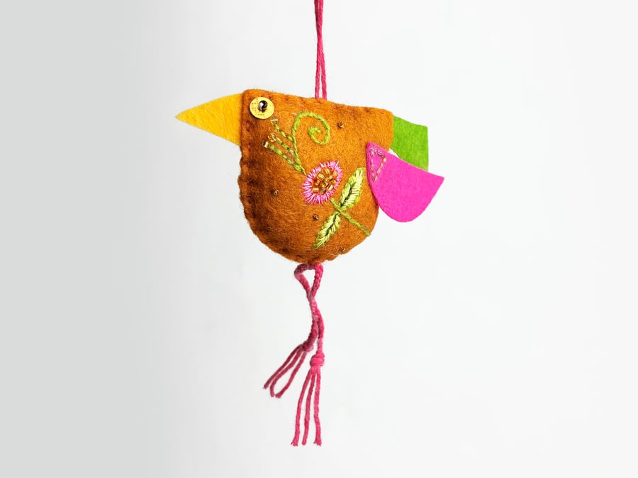   Caramel coloured felt bird with hand embroidered body