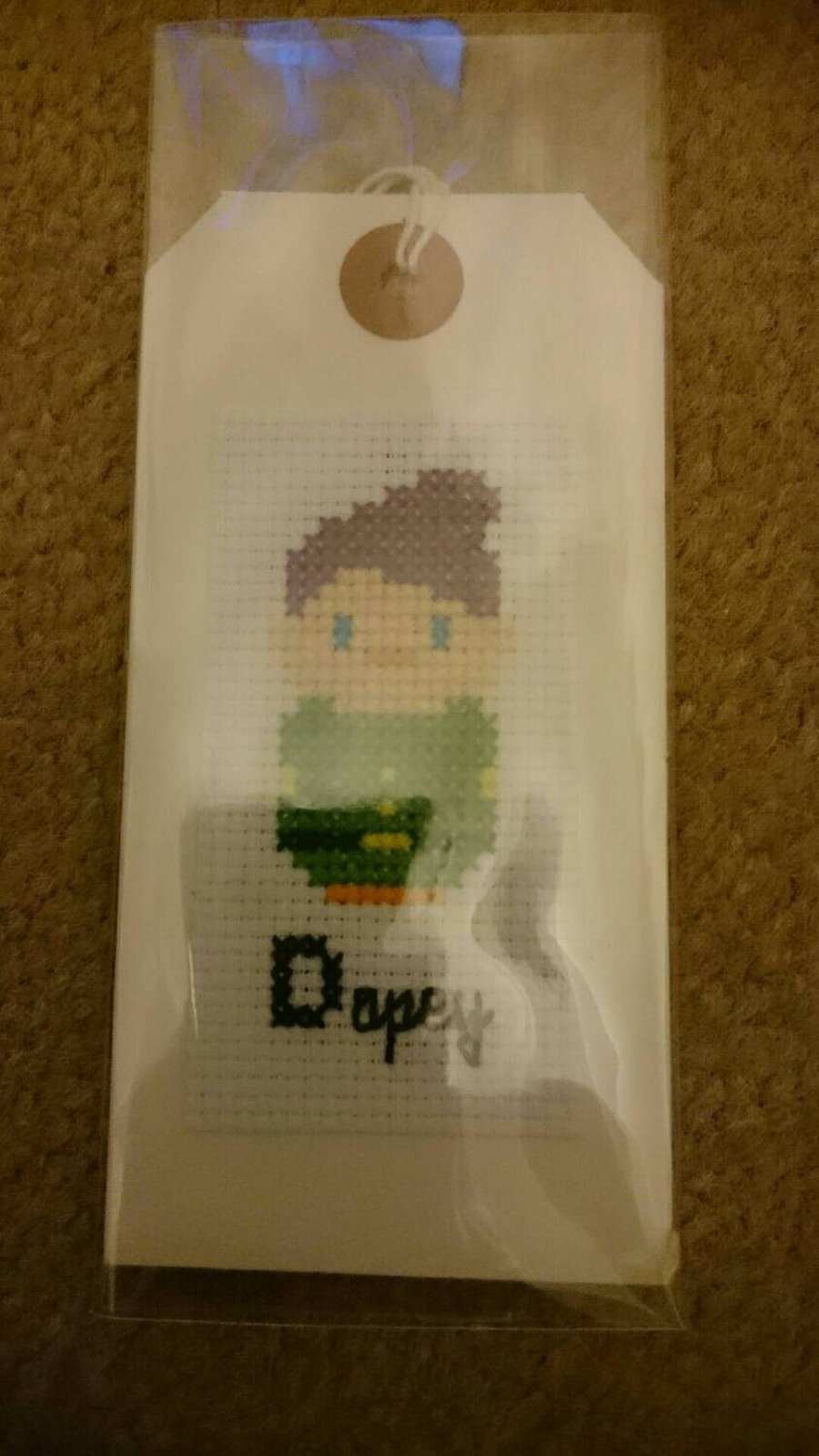 Cute cross stitched dopey gift tag. Have this made to brighten up that special g