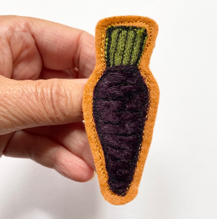 Purple carrot vegetable harvest brooch pin or badge.