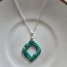 Polymer green and gold necklace on a silver plated chain