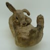 Ceramic Rabbit washing its tummy
