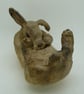 Ceramic Rabbit washing its tummy