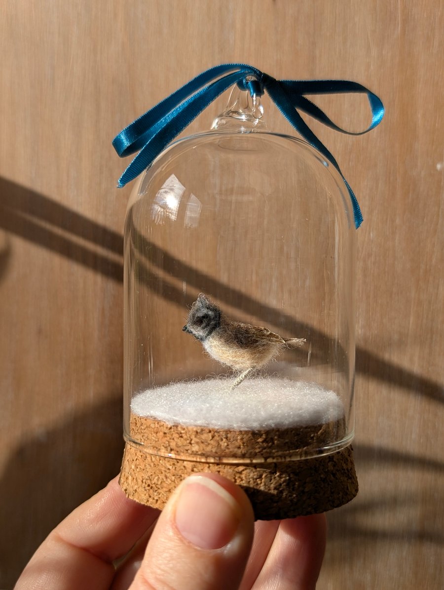 Tiny wool miniature Crested Tit in hanging bell-jar