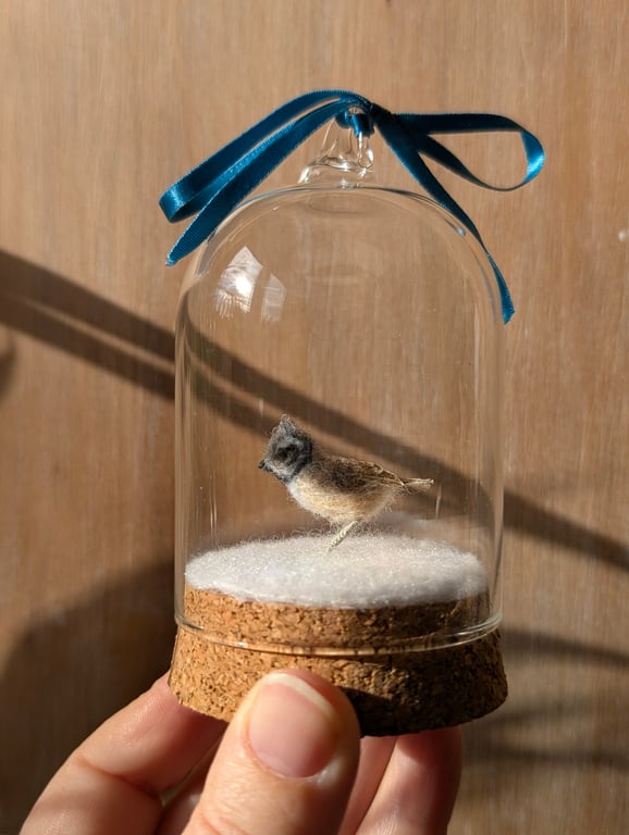 Tiny wool miniature Crested Tit in hanging bell-jar
