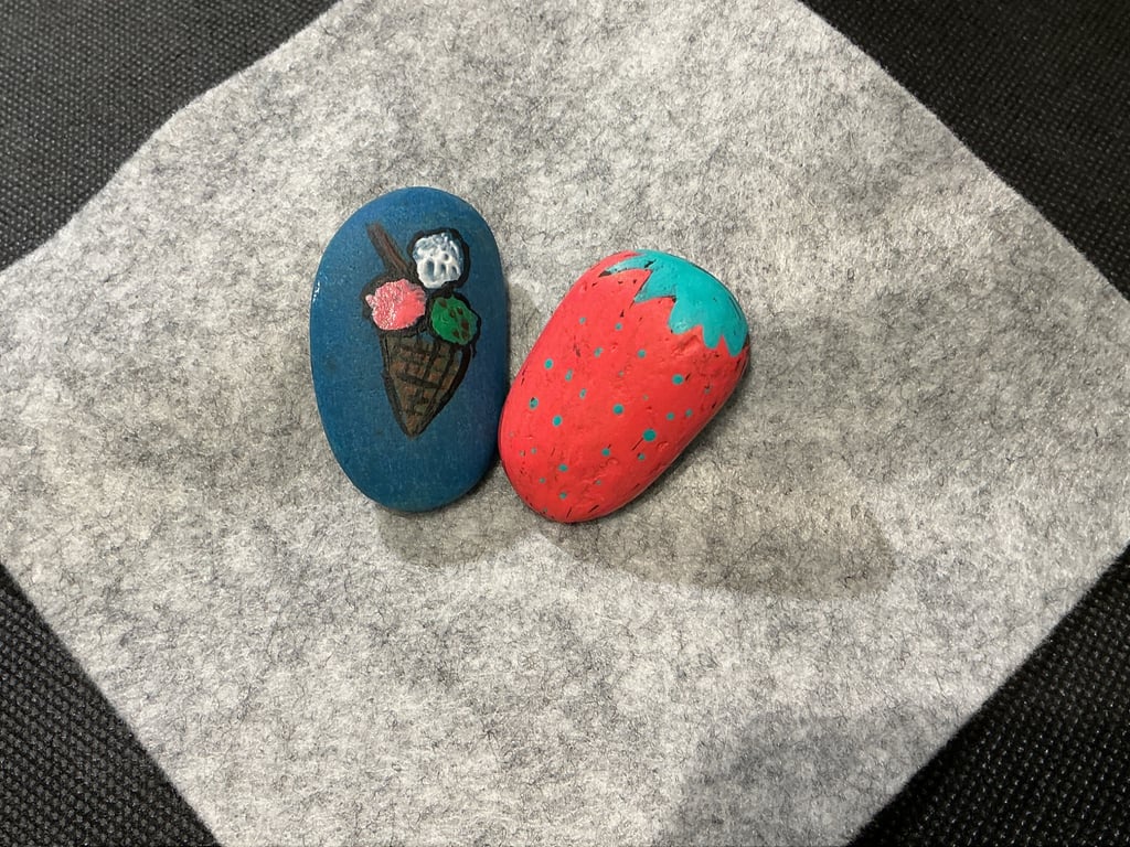 Set of 2 hand painted pebbles with  strawberry and ice cream theme.