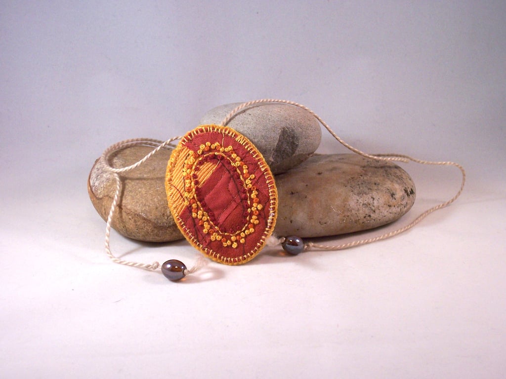 Hand embroidered fabric necklace with french knots