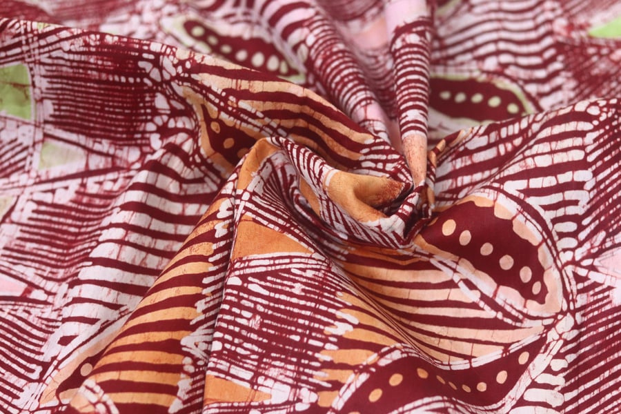 multicoloured cassava flower inspired hand printed African adire batik fabric