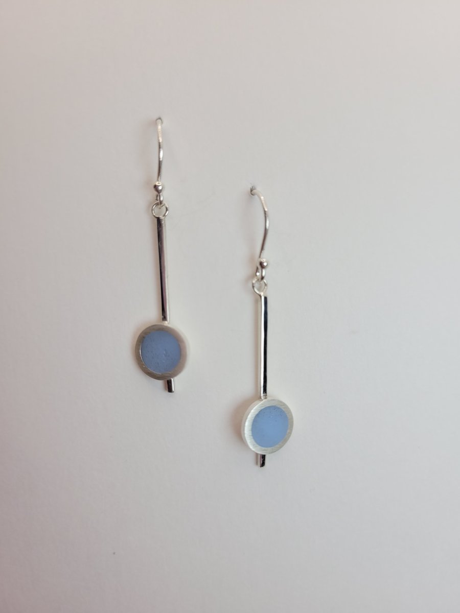 Silver dangley earrings with pale blue circle