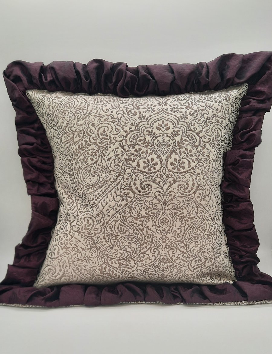 Cushion  cover- white sand and taupe jacquard with plum edging.  