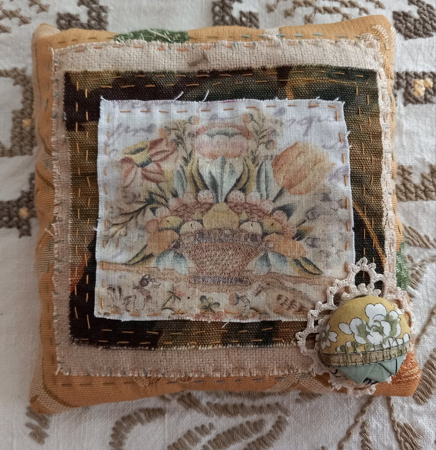 Golden yellow floral hand-stitched lavender pillow.
