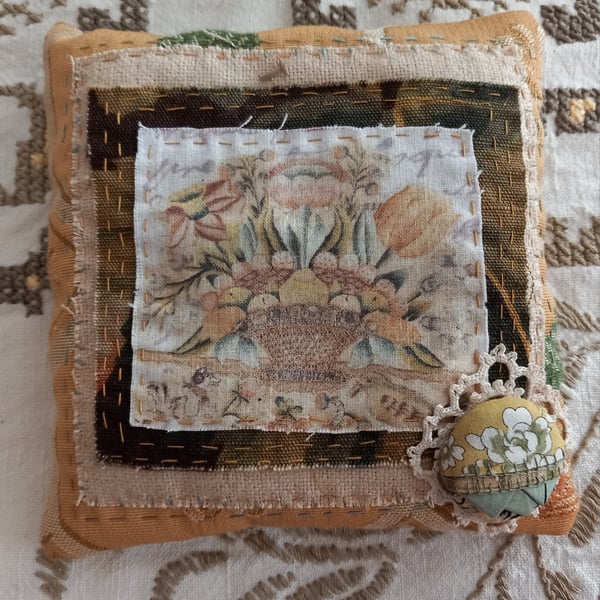 Golden yellow floral hand-stitched lavender pillow.