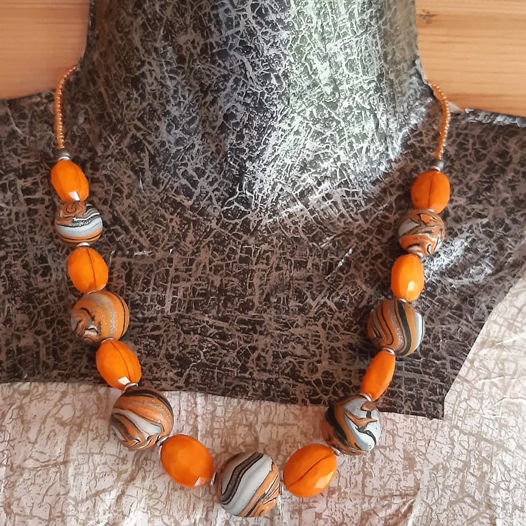 Handmade necklace in orange, black and white polymer clay