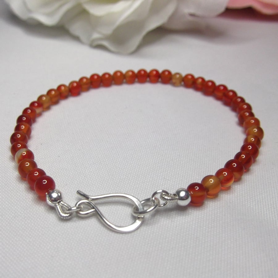 Carnelian gemstone bracelet of small round beads with recycled silver clasp