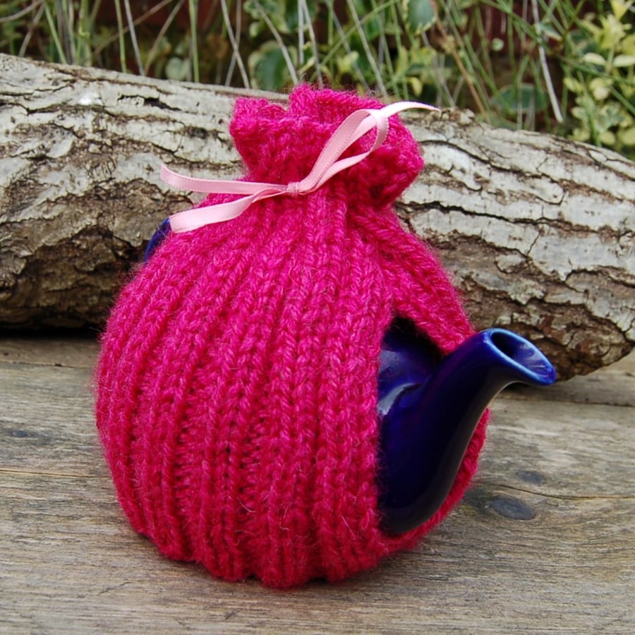 Tea cosy hand knitted.  Will fit a small one or two cup teapot.