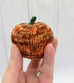 Hand knitted mini pumpkin pin cushion variegated orange - Image 1