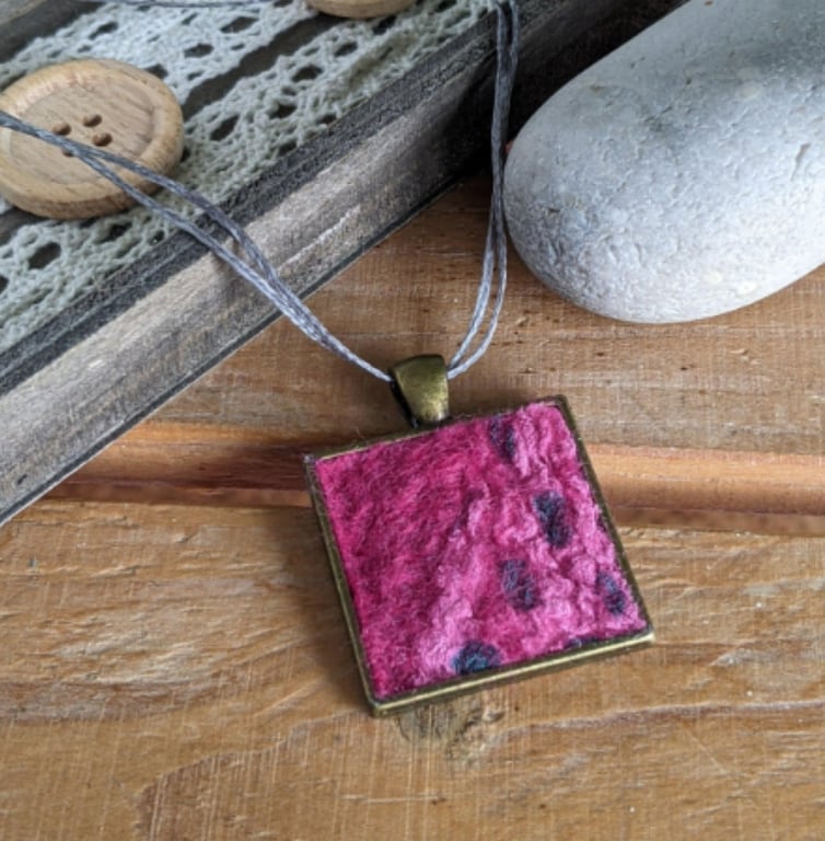 Felted square pendant - deep pink in a bronze bezel