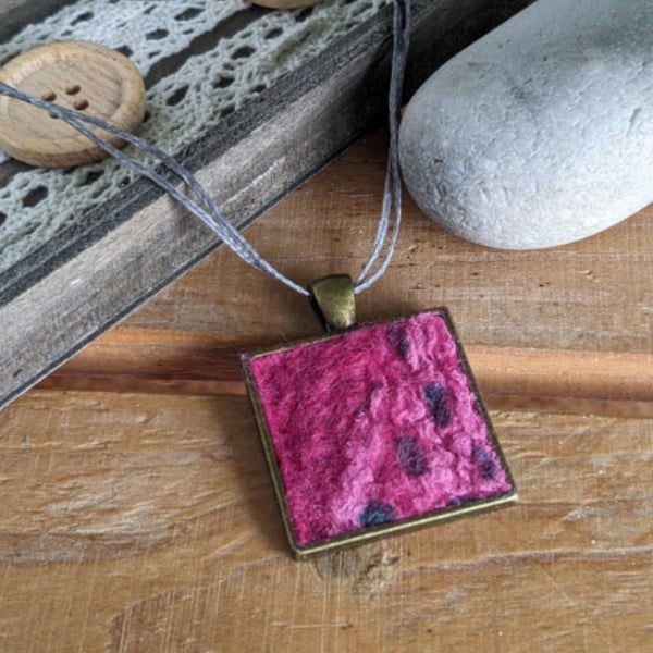 Felted square pendant - deep pink in a bronze bezel