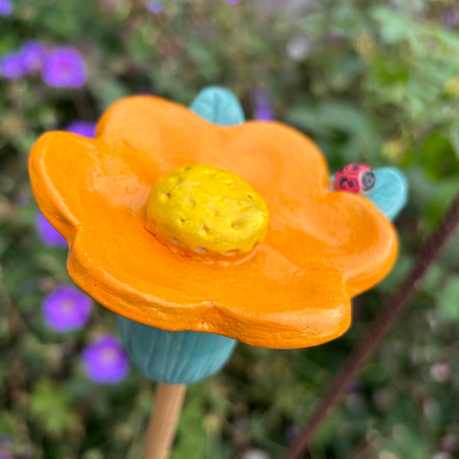 Orange and yellow flower cane topper