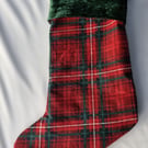 Tartan stocking with green velour cuff, tartan lining and hanging loop.