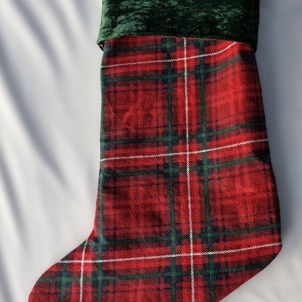 Tartan stocking with green velour cuff, tartan lining and hanging loop.