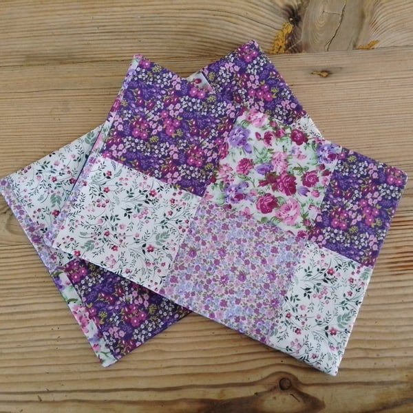 Pair of cushion covers made in a floral purple theme with an envelope closure.