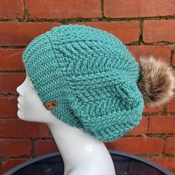 Crochet green beanie hat with pompom