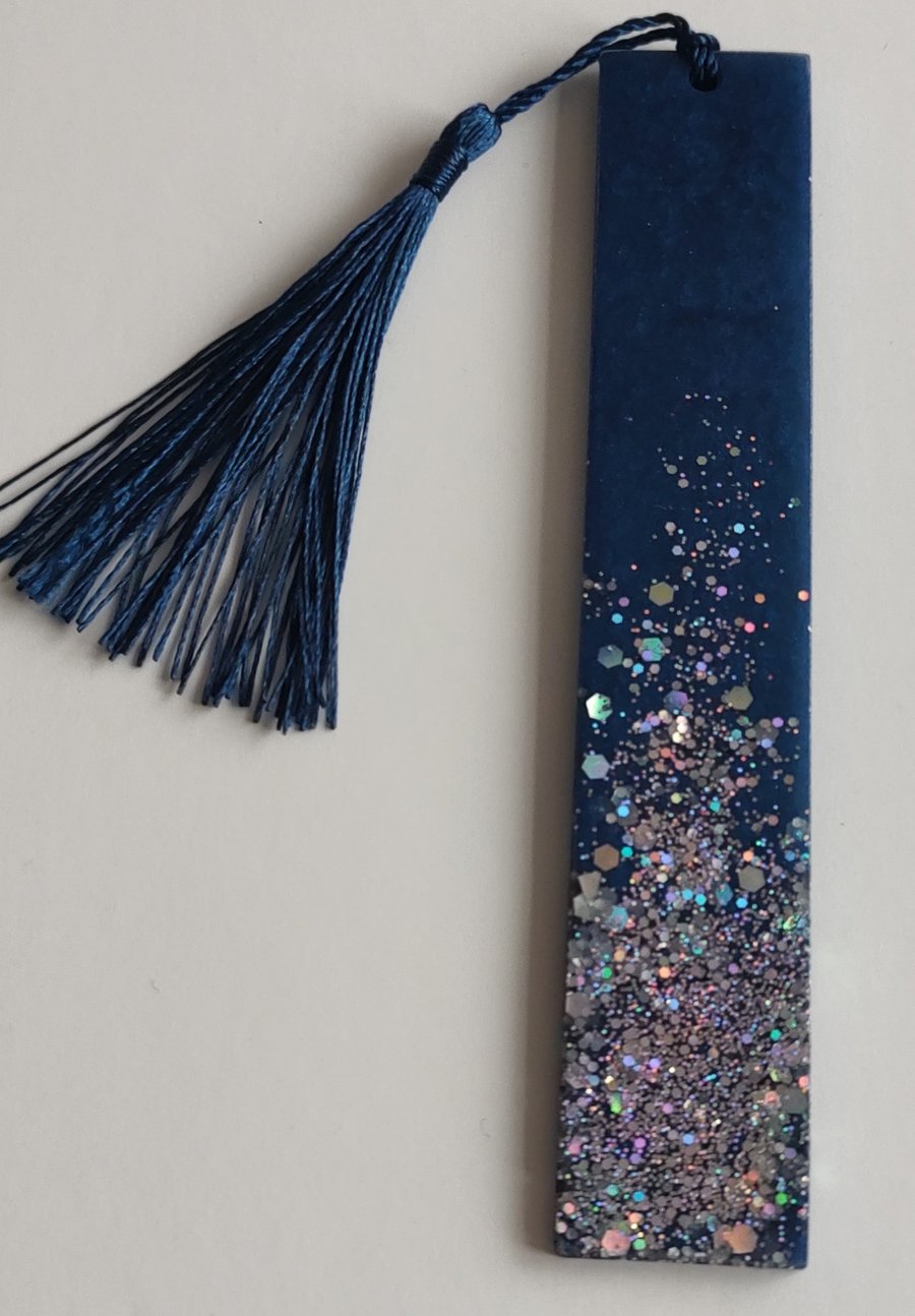 Handmade resin bookmark in navy blue with holographic multicoloured spinkles.
