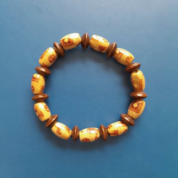 Handmade brown wooden bead bracelet. Women's elastic jewelry.