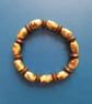 Handmade brown wooden bead bracelet. Women's elastic jewelry.