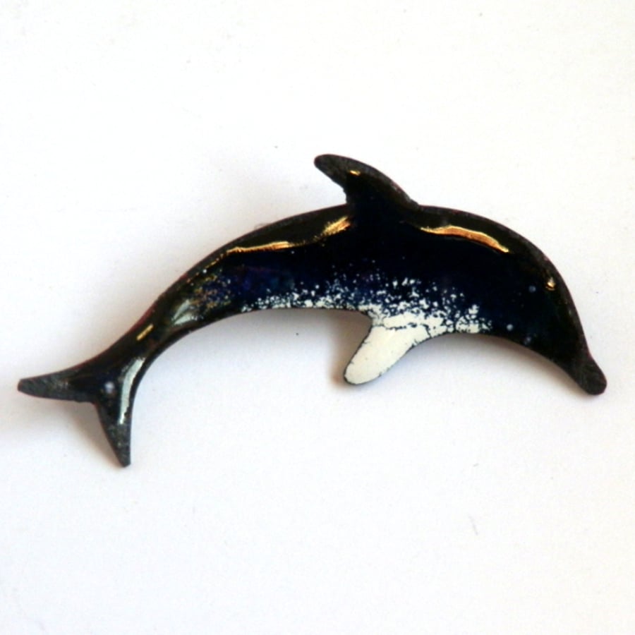 black, blue, white dolphin brooch