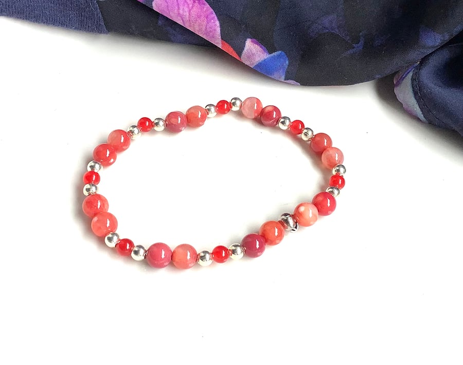 Ruby fire agate & red jade bracelet with silver coated beads