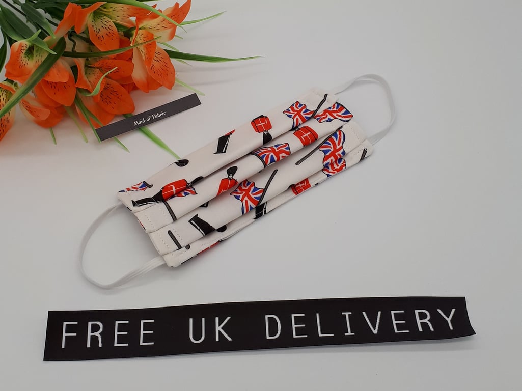 Face mask, small, 3 layer,  machine washable in white Queens guard fabric.  