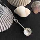 Sterling silver spoon pendant with hammered detail.