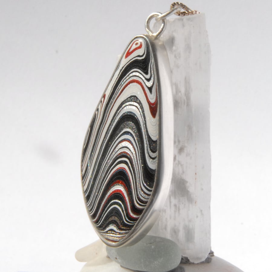 Striking sterling silver and Detroit fordite pendant