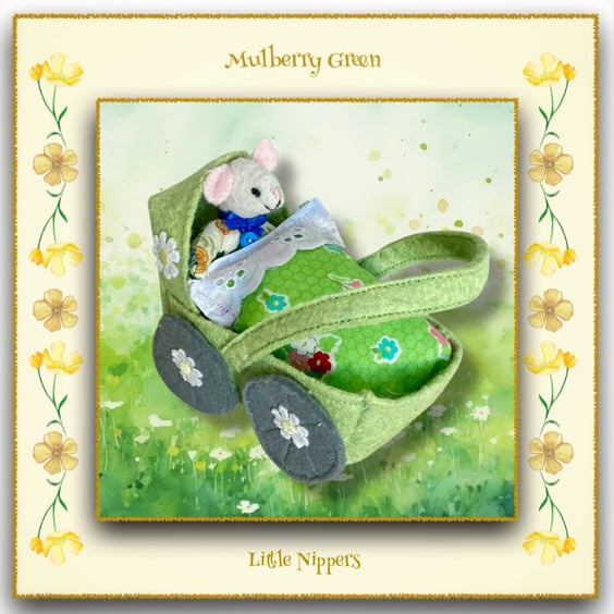 A Baby Pip Squeak in a Green Felt Pram 