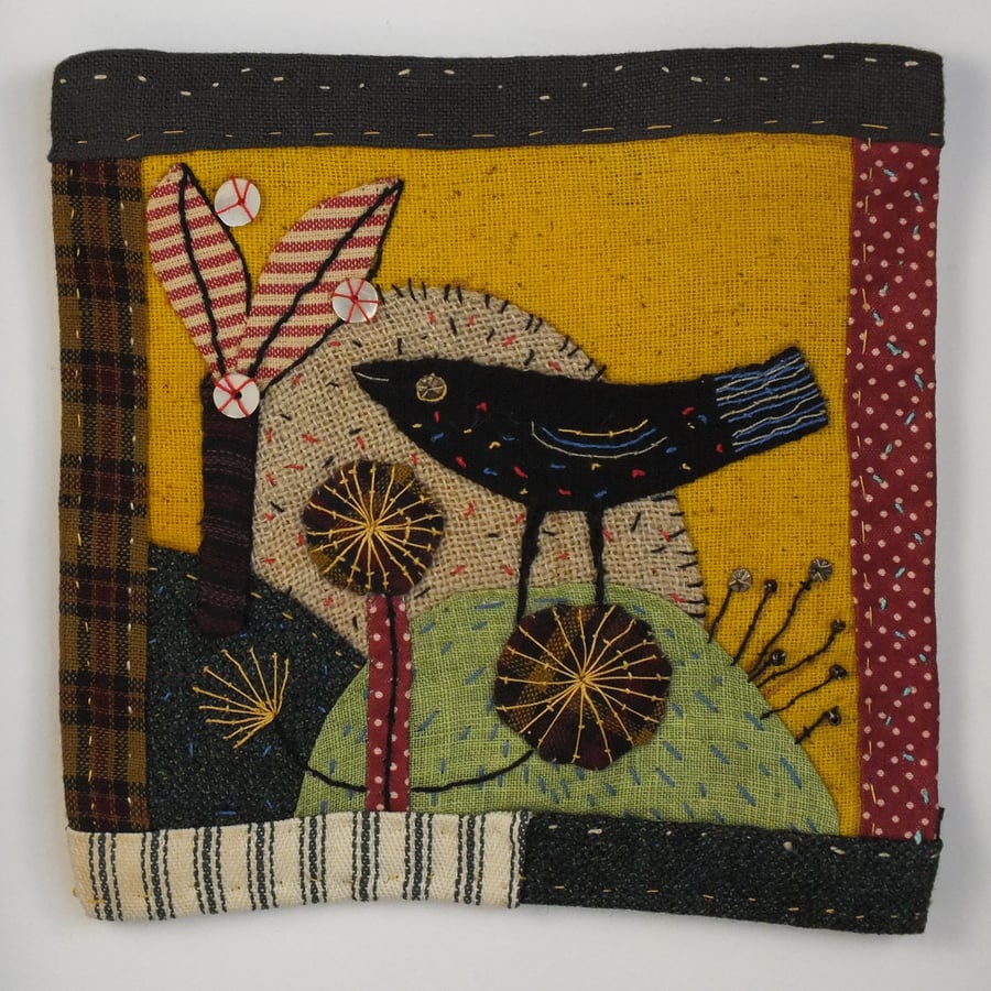 Folk art applique,patchwork,embroidery framed bird picture