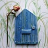 Blue ceramic fairy door