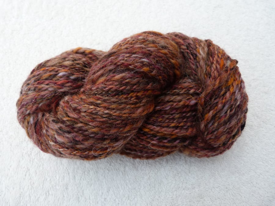 100g Hank of Hand Spun Art Yarn in Purples, Orange and Natural Fleece.