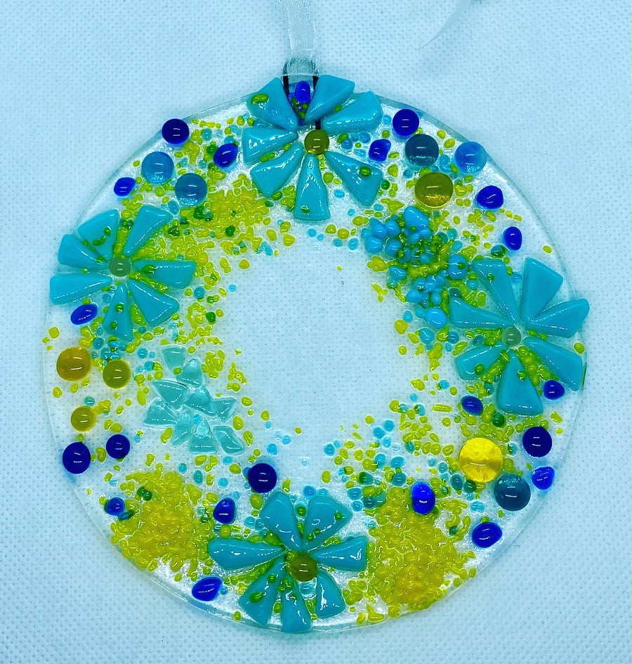 Fused glass hanging decoration in blues and yellows