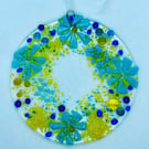 Fused glass hanging decoration in blues and yellows