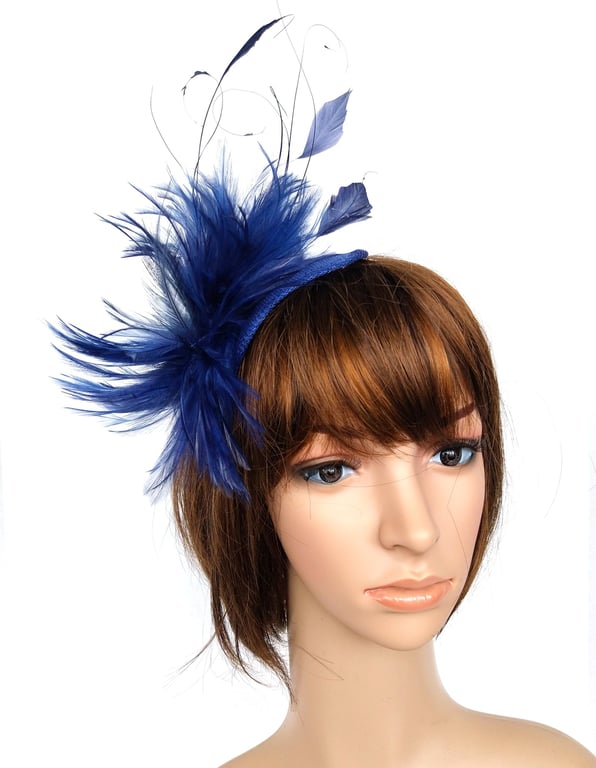 Dark blue fascinator with a feather explosion