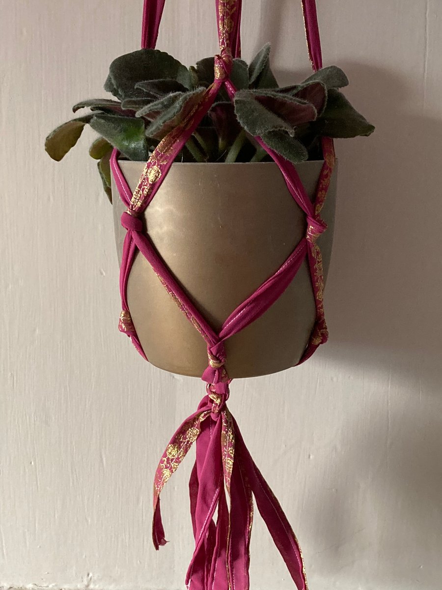 Macrame plant holder made from pre-loved sari fabric.