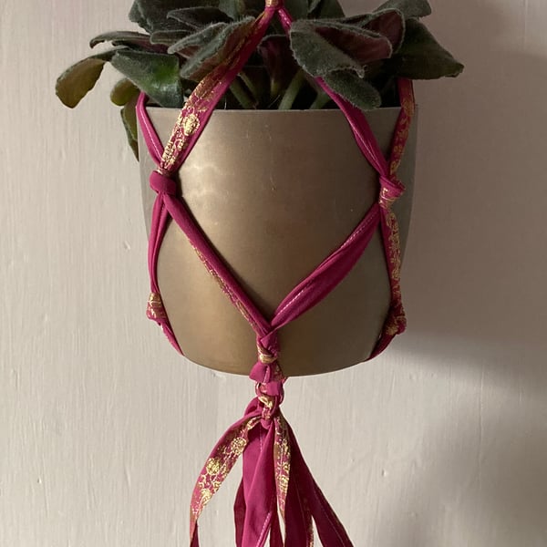 Macrame plant holder made from pre-loved sari fabric.