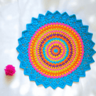large, bright, crochet doily, mandala table mat