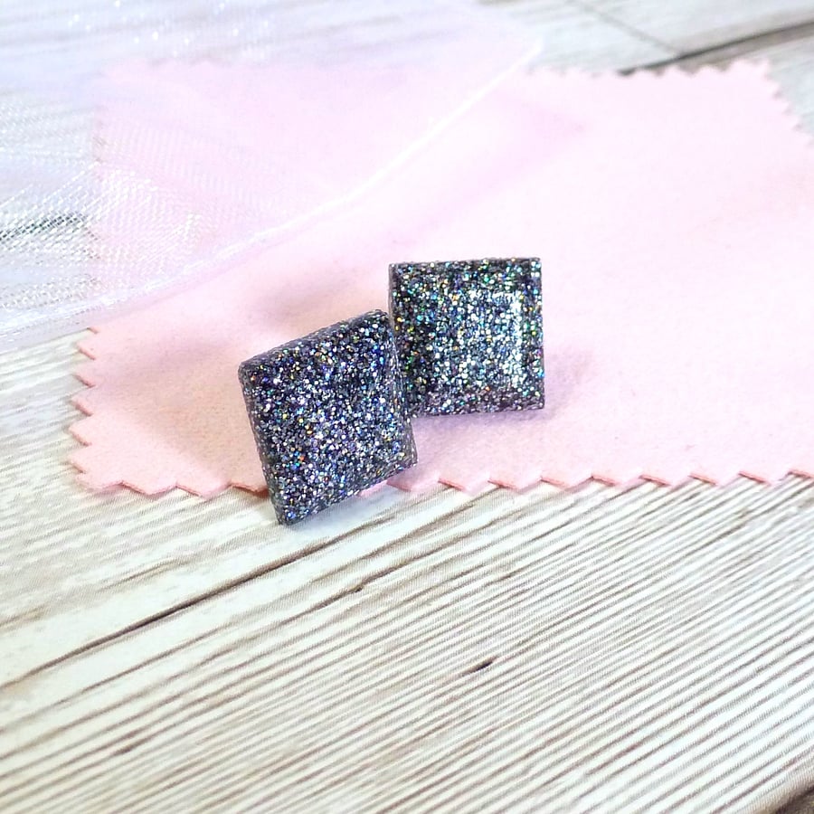 Silver holographic glitter square studs. Sparkly glitter earrings