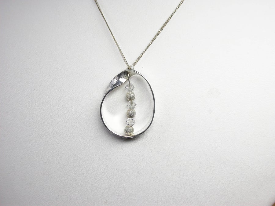 The Mobius Loop in Sterling Silver with Swarovski Frosted Beads