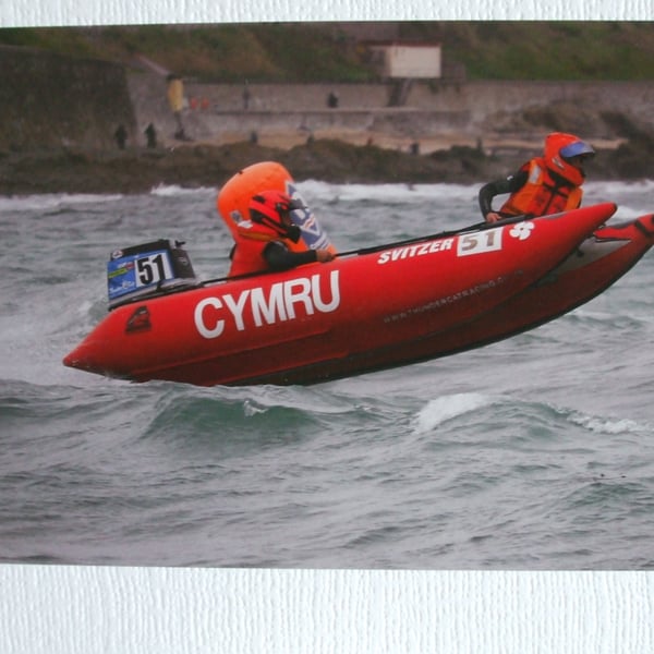 Photographic card of a "Thunder Cat" racing rib "Cymru".